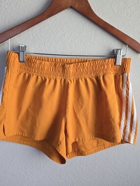 adidas Women’s Bright Orange Athletic Shorts with White Stripes